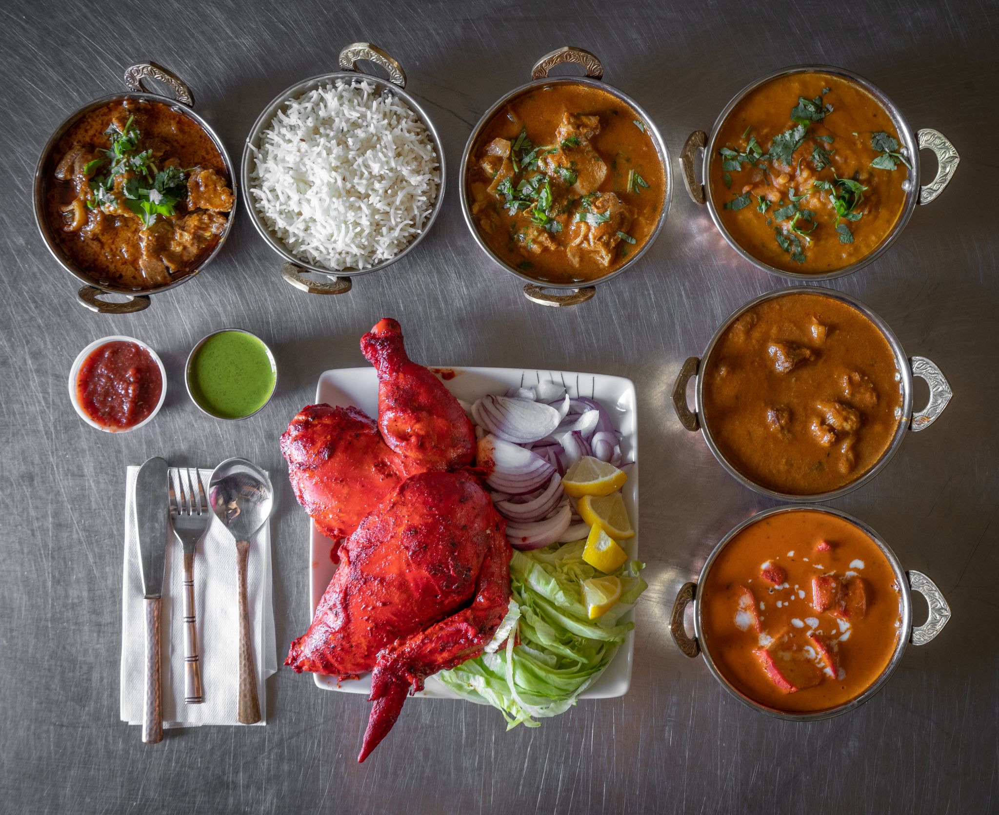 Delicious Indian food spread featuring vibrant tandoori chicken and aromatic curries.